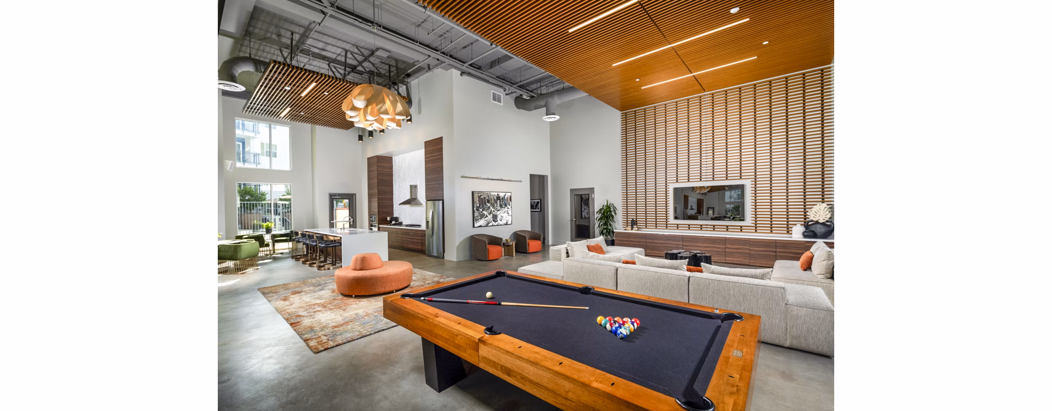 Aston at Gateway: Clubhouse game room with pool table and modern decor, luxury amenity at Greystar's upscale apartments