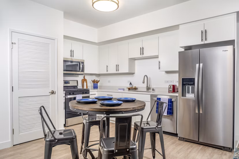 Dining area with modern decor and natural lighting at Aston at Gateway Apartments
