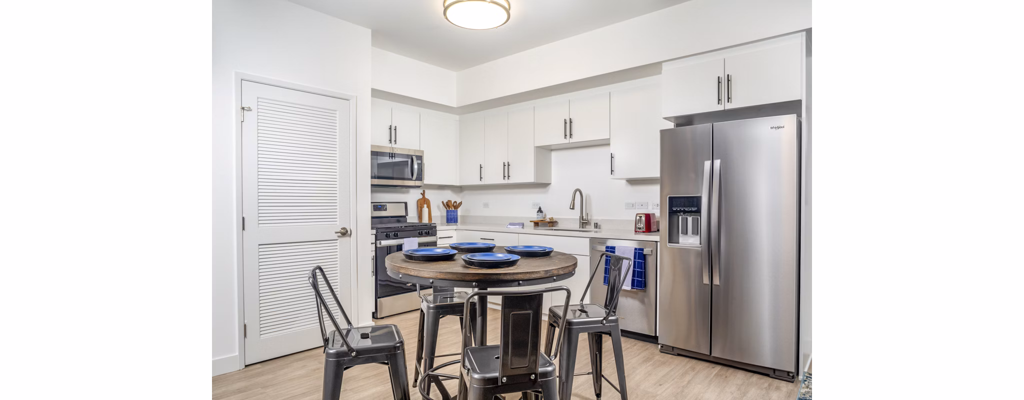 Dining area with modern decor and natural lighting at Aston at Gateway Apartments