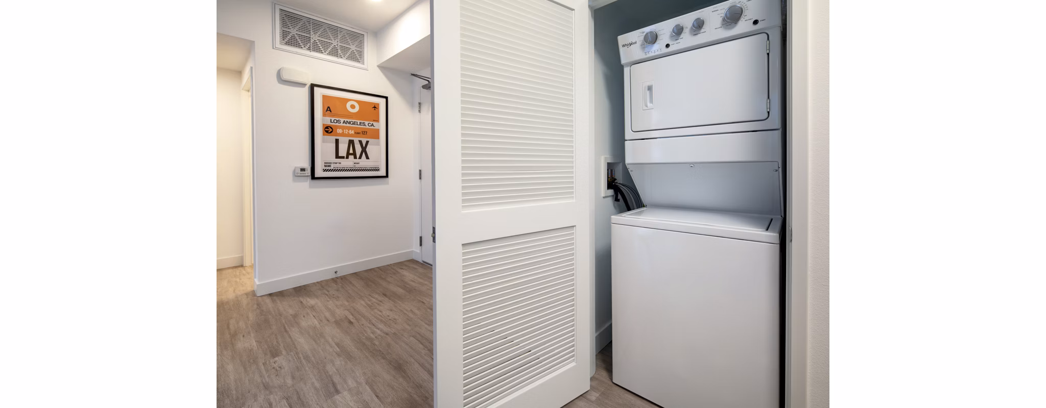 Laundry room with modern washers and dryers at Aston at Gateway Apartments, offering convenient amenities for residents