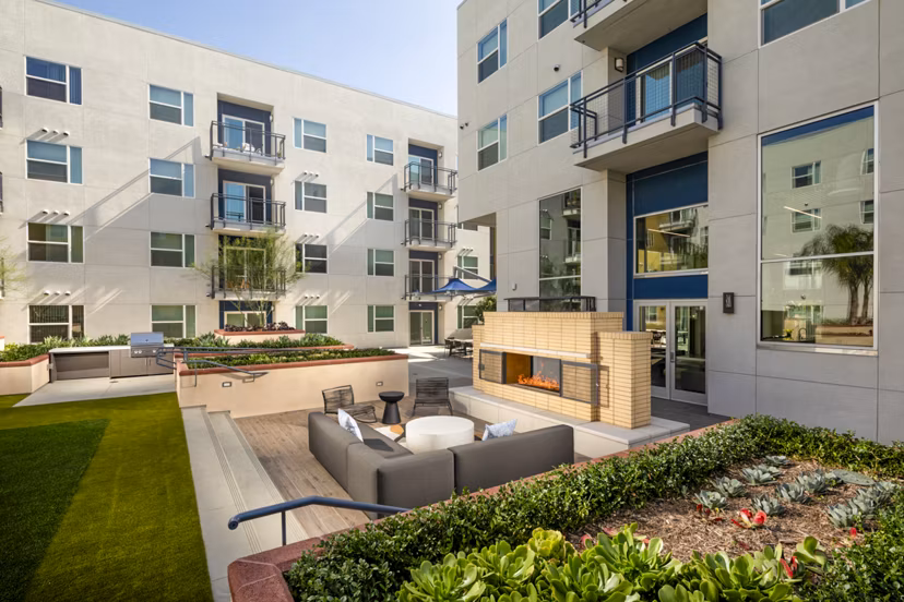 Fire pit and cozy patio area at Aston at Gateway Apartments