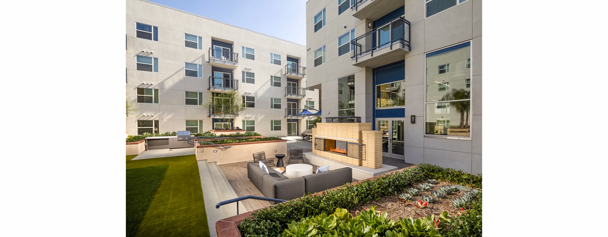 Fire pit and cozy patio area at Aston at Gateway Apartments
