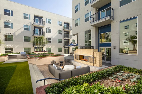 Fire pit and cozy patio area at Aston at Gateway Apartments