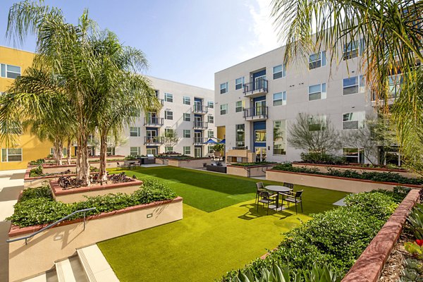 Fire pit on cozy patio at Aston at Gateway Apartments, perfect for luxury outdoor relaxation