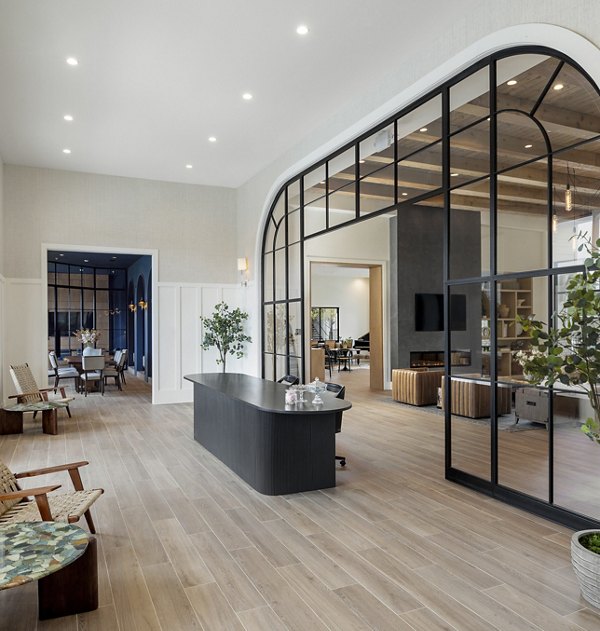 Clubhouse with modern design and ample seating at Maxwell Apartments, by Greystar
