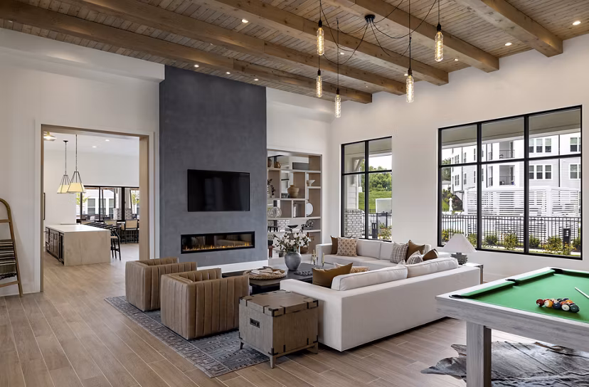Elegant clubhouse with plush seating and modern decor at Maxwell Apartments