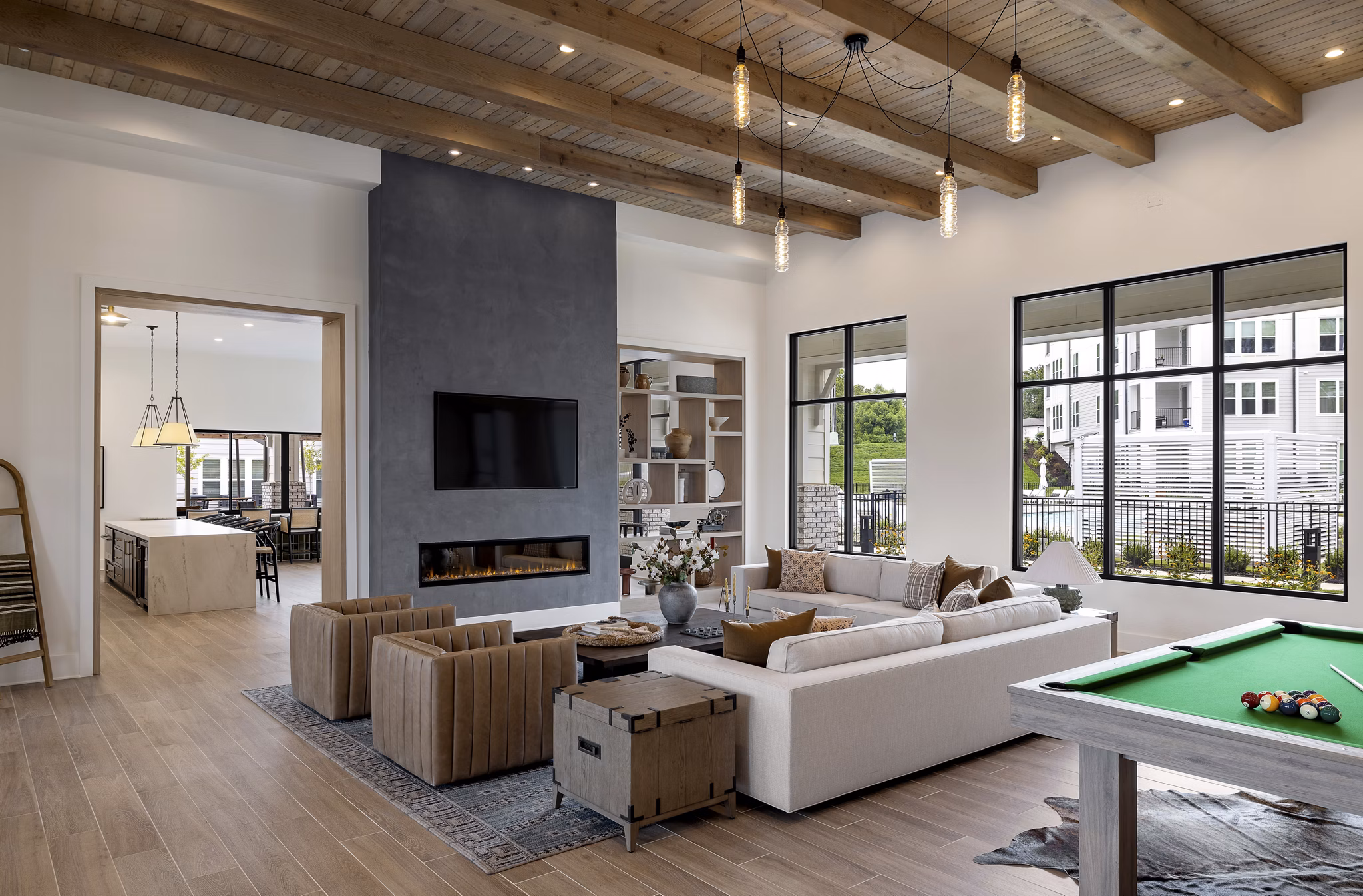 Elegant clubhouse with plush seating and modern decor at Maxwell Apartments