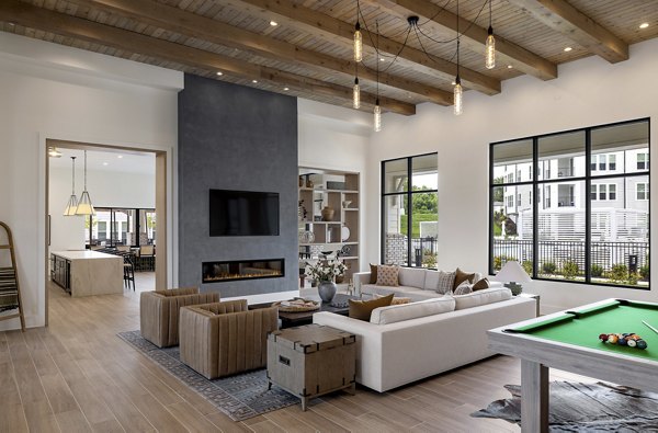 Elegant clubhouse with plush seating and modern decor at Maxwell Apartments