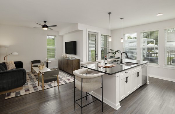 Modern kitchen with stainless steel appliances in Maxwell Apartments