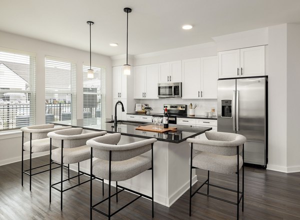 Sleek modern kitchen with stainless steel appliances at Maxwell Apartments