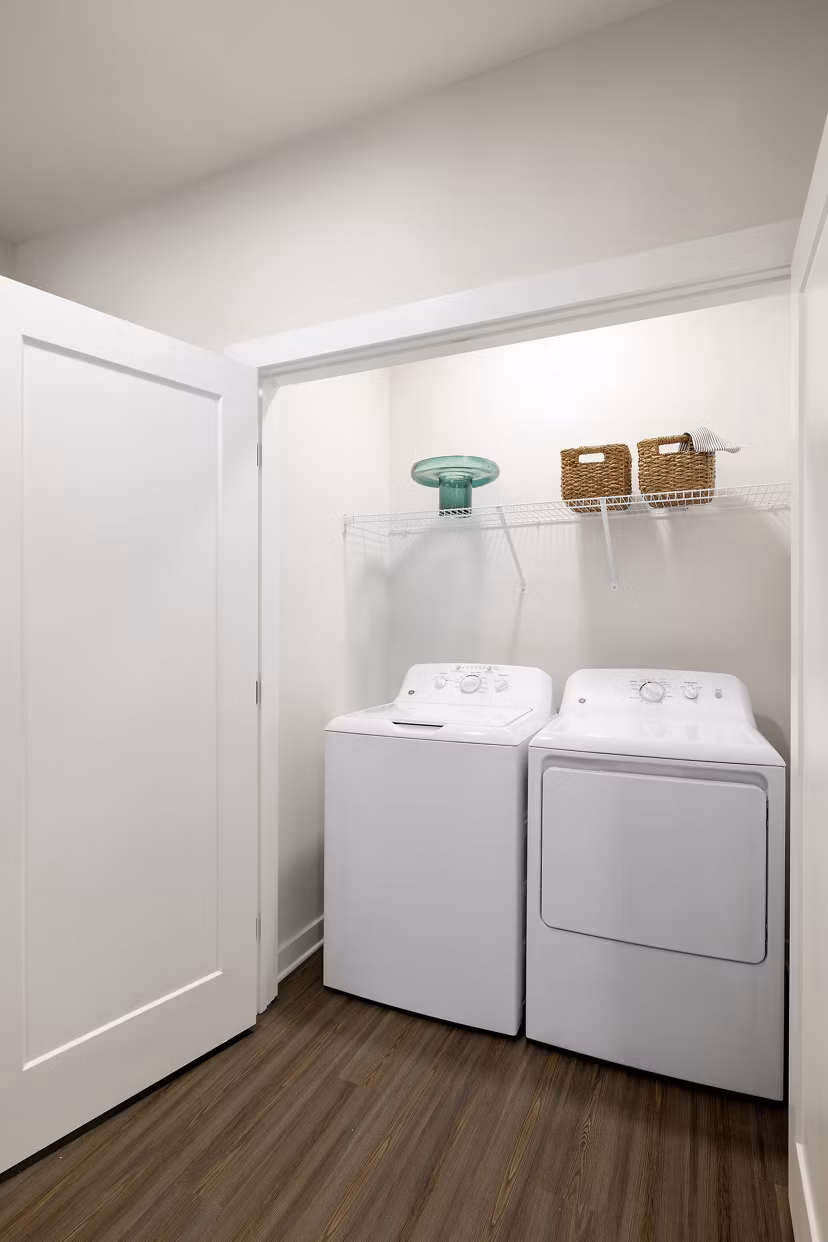 Laundry room with modern appliances at Maxwell Apartments
