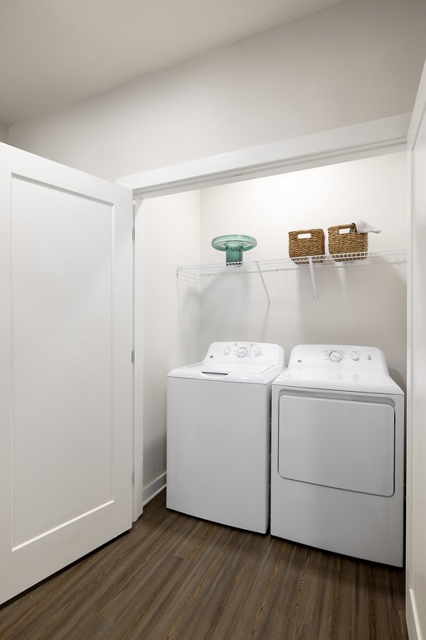 Laundry room with modern appliances at Maxwell Apartments