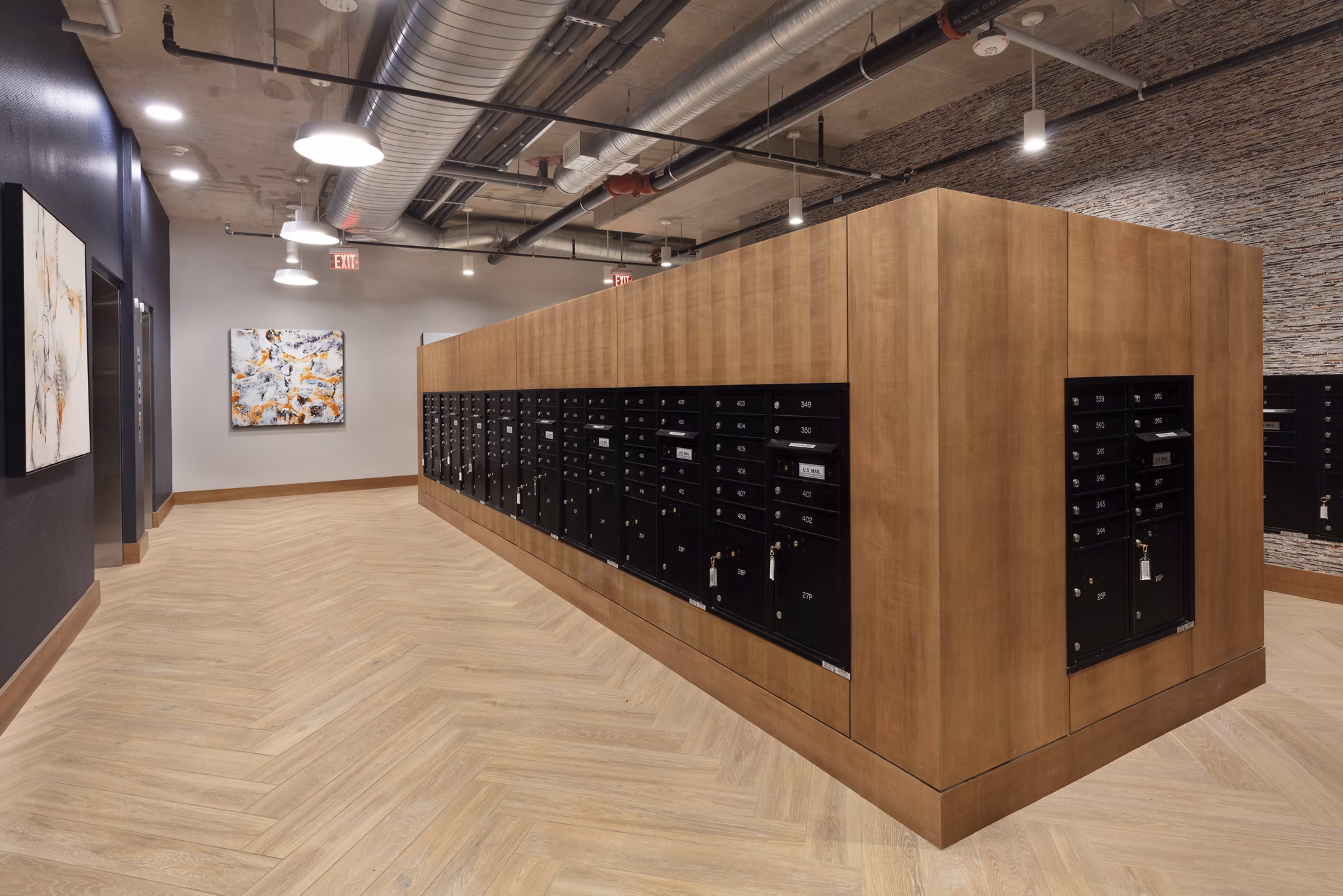 Mail room with package lockers at The Blake Apartments