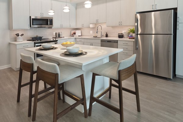 Modern kitchen with stainless steel appliances at The Blake Apartments