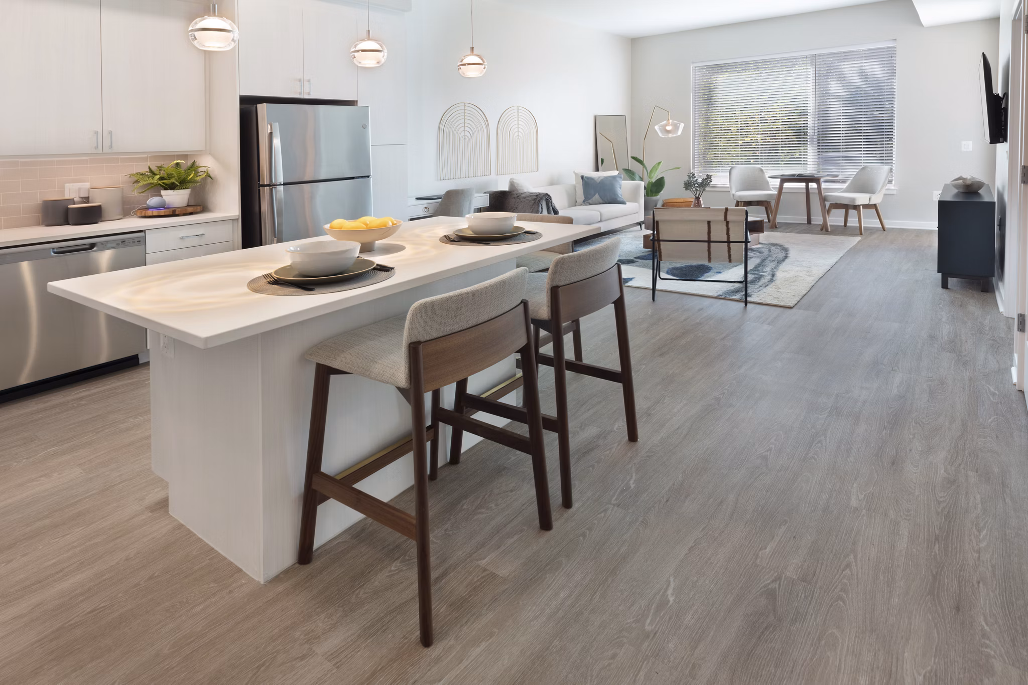 Modern kitchen with stainless steel appliances at The Blake Apartments, offering luxury living spaces in a prime urban location