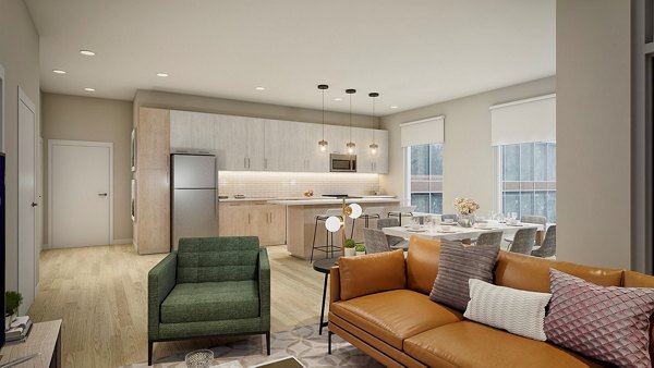 Spacious living room with contemporary design at The Blake Apartments, featuring luxury finishes and abundant natural light