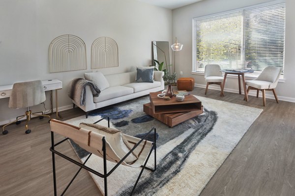 Spacious living room with stylish decor in The Blake Apartments