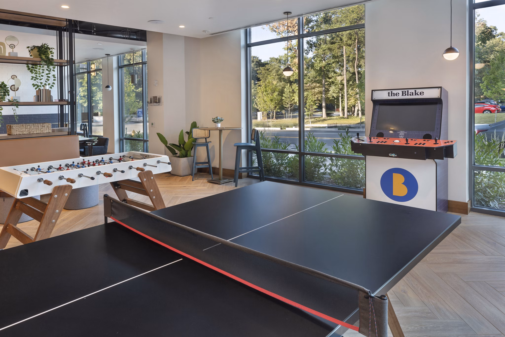 Game room featuring pool table and lounge area at The Blake Apartments
