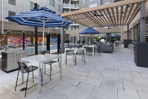 Expansive patio with outdoor seating at The Blake Apartments, ideal for relaxation and social gatherings, offering luxury living experiences