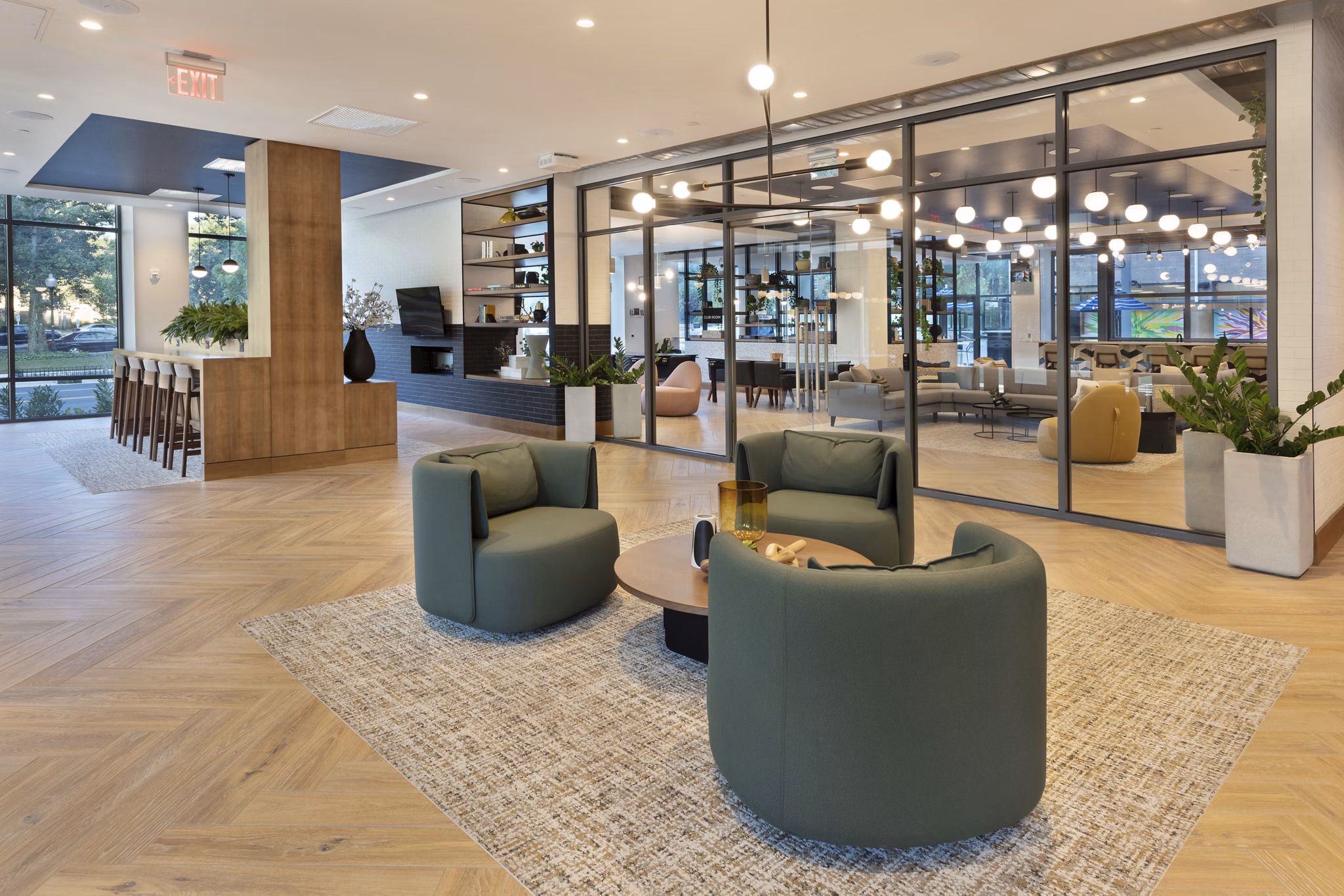 Inviting clubhouse with contemporary furnishings at The Blake Apartments, perfect for social gatherings and relaxing with friends