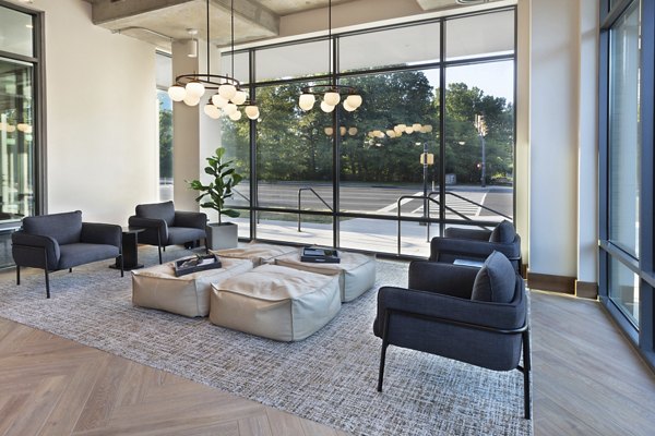 Modern clubhouse with spacious seating areas and stylish decor at The Blake Apartments