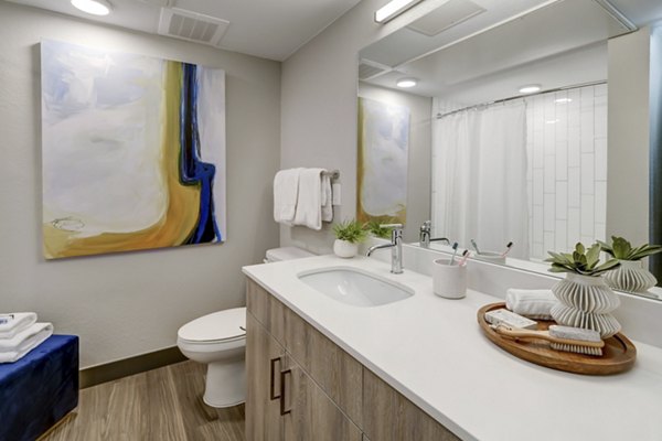 Modern bathroom featuring elegant fixtures at Novus Apartments, offering luxury living spaces in a premium setting