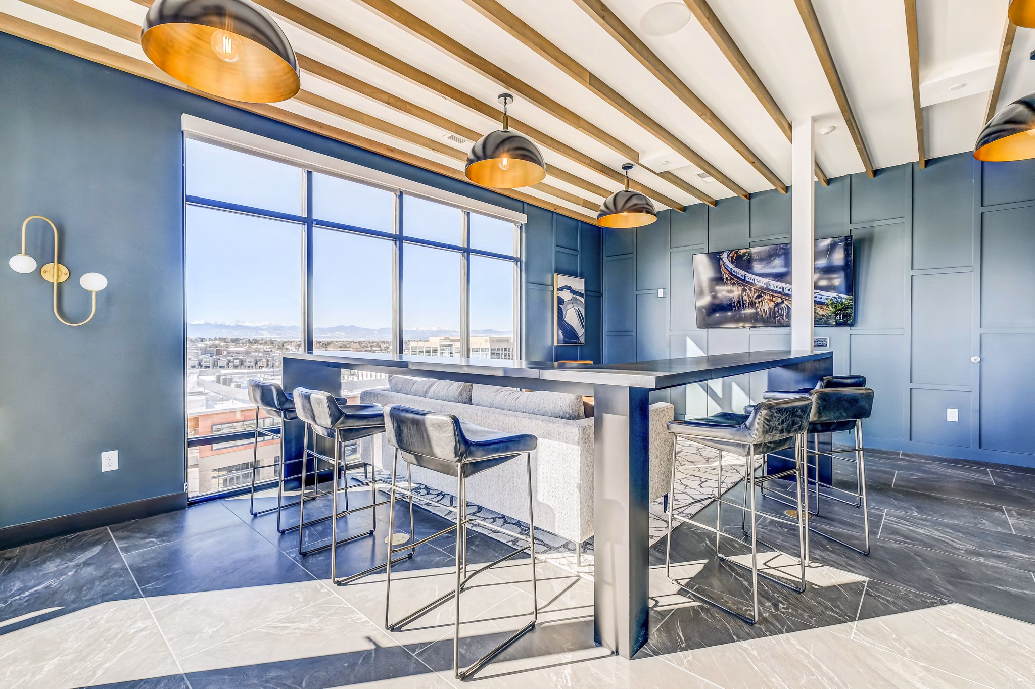 Clubhouse featuring modern design and ample seating at Novus Apartments