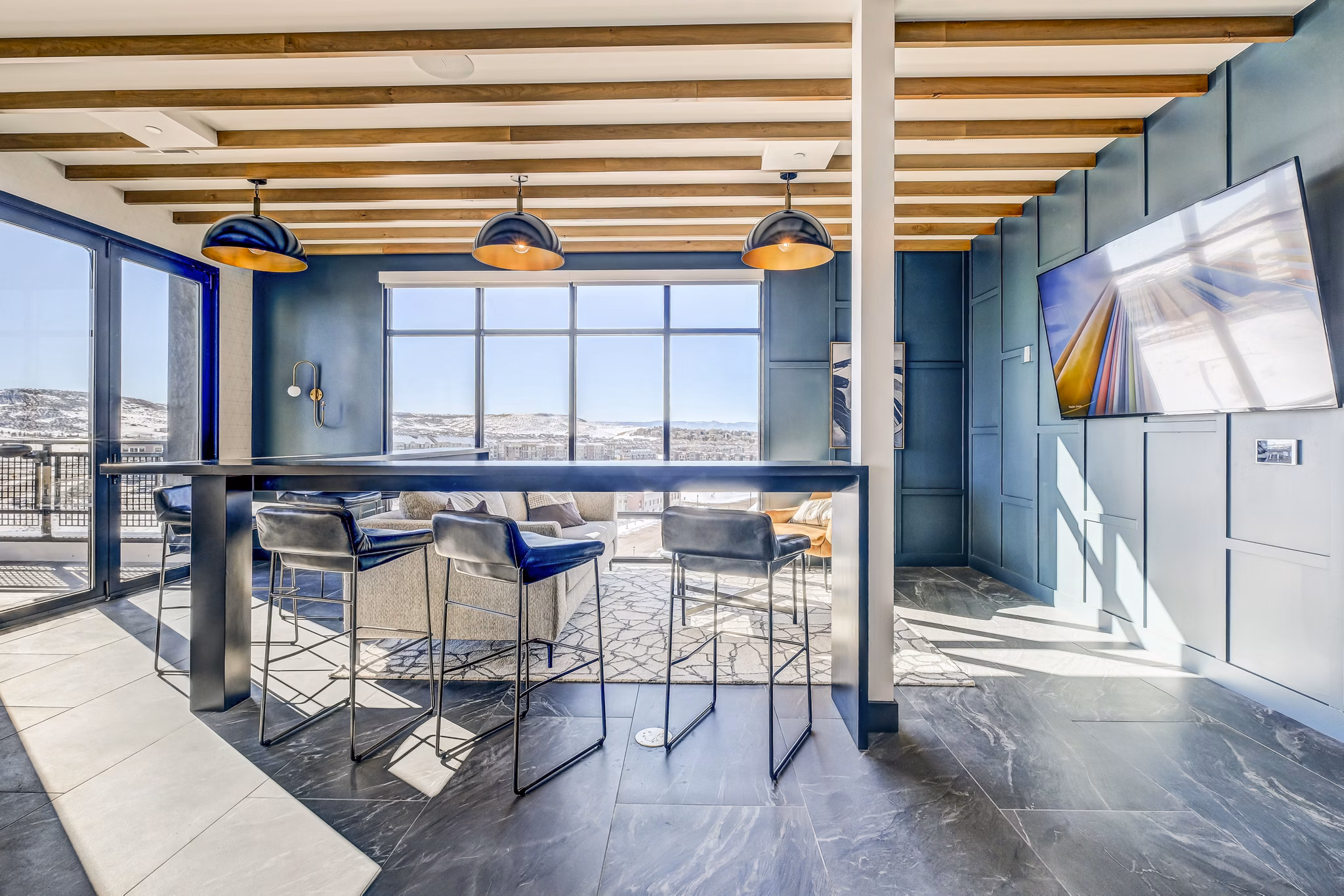 Clubhouse with modern lounge seating at Novus Apartments