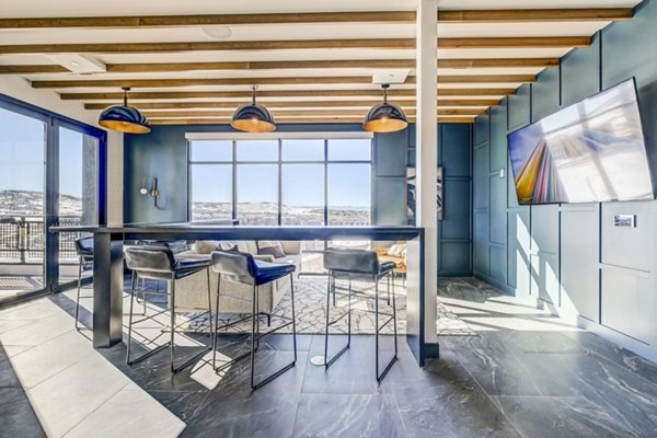 Clubhouse with modern lounge seating at Novus Apartments