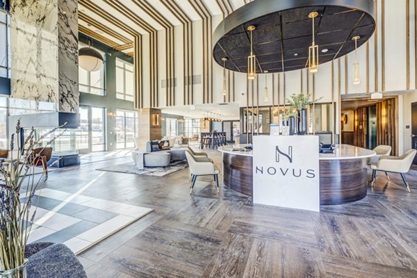 Luxurious clubhouse lobby with modern furnishings and elegant lighting at Novus Apartments