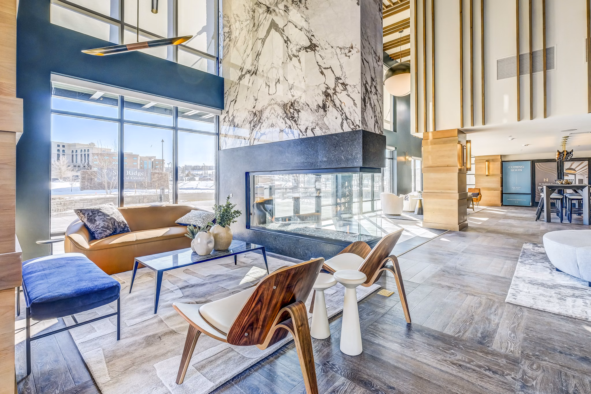 Clubhouse lobby featuring modern design and seating at Novus Apartments