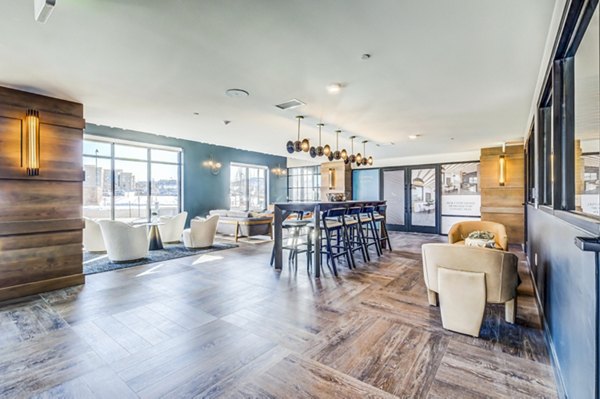 Clubhouse featuring modern decor and comfortable seating at Novus Apartments