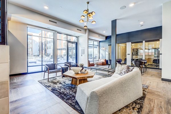 Clubhouse featuring modern design and cozy seating at Novus Apartments, a luxury community by Greystar