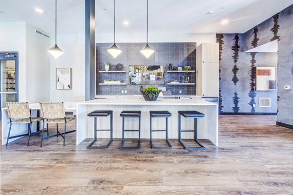 Clubhouse with modern design and communal seating at Novus Apartments