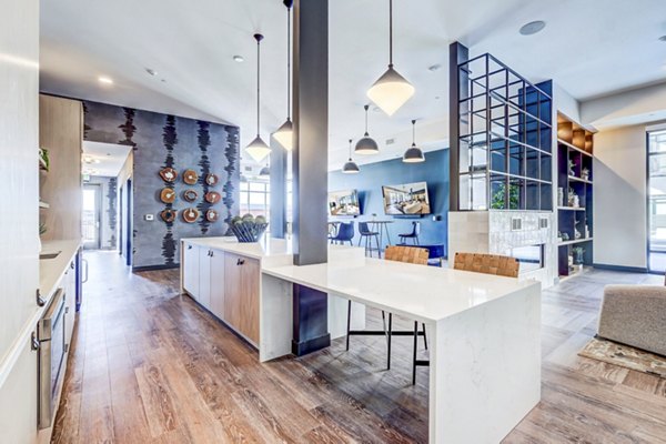 Novus Apartments: Stylish clubhouse with contemporary design and comfortable seating in a luxury community