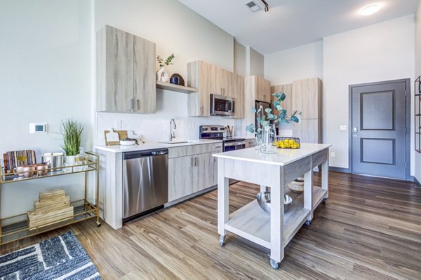 Modern kitchen with stainless steel appliances at Novus Apartments