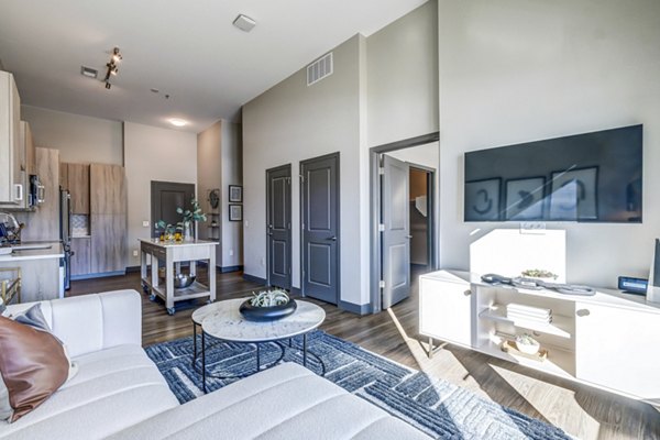 Modern living room with open layout and stylish decor at Novus Apartments, enhancing luxury apartment living experience
