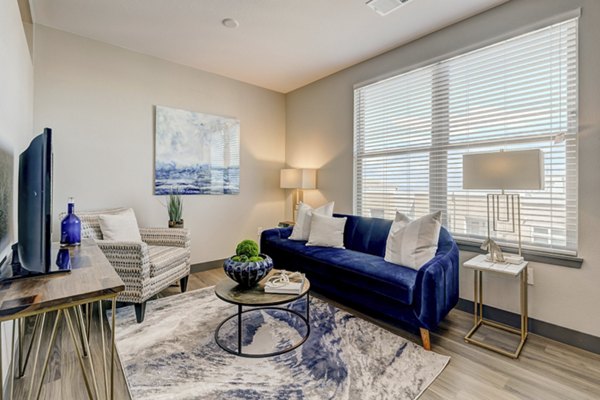 Spacious living room with elegant furnishings at Novus Apartments, a Greystar luxury community