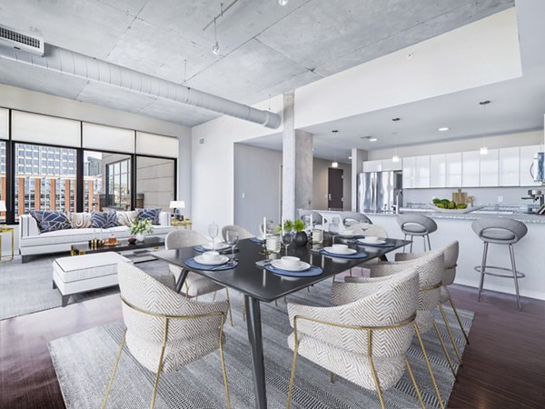 Dining room with sleek modern furnishings and elegant decor at The Flats at East Bank Apartments