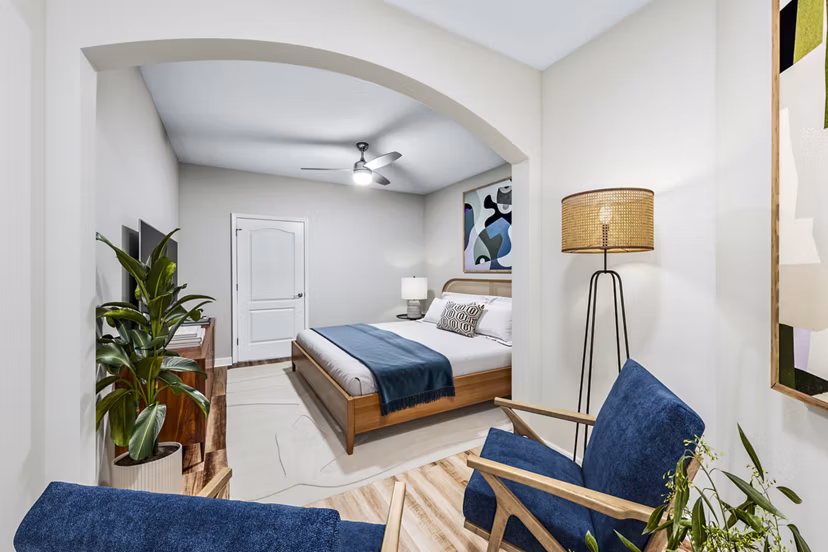 Modern bedroom with stylish decor at The Avens at Dedham Station Apartments