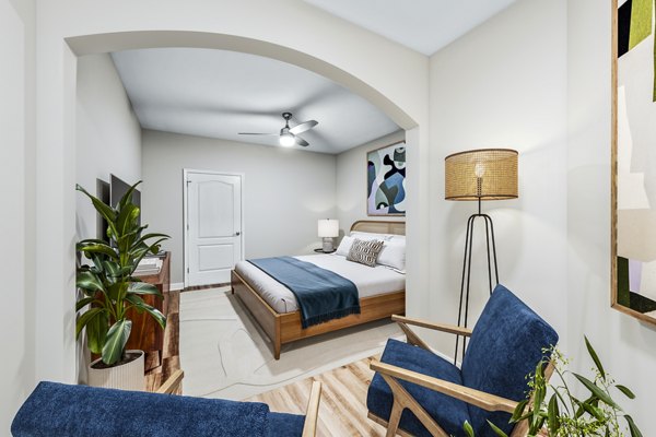 Modern bedroom with stylish decor at The Avens at Dedham Station Apartments