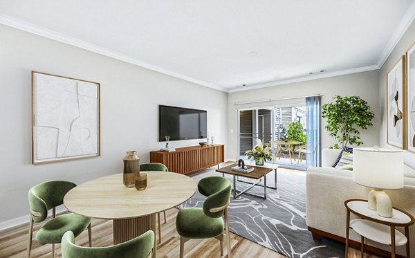 Dining room with modern decor and stylish lighting at The Avens at Dedham Station Apartments