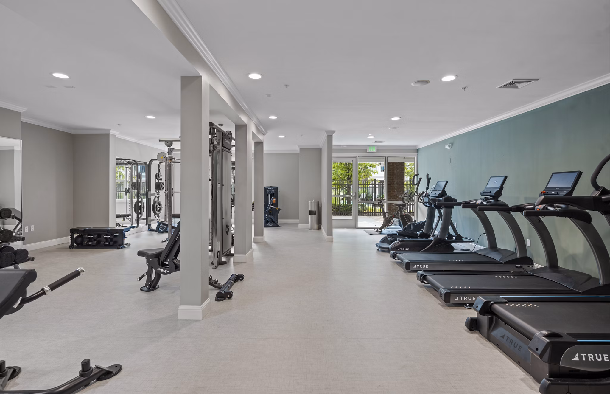 State-of-the-art fitness center with modern equipment at The Avens Dedham Station Apartments