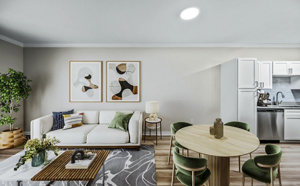 Modern living room with elegant furnishings at The Avens at Dedham Station Apartments