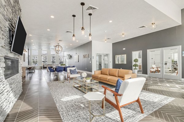 Clubhouse featuring modern design and spacious seating at Millpond Apartments