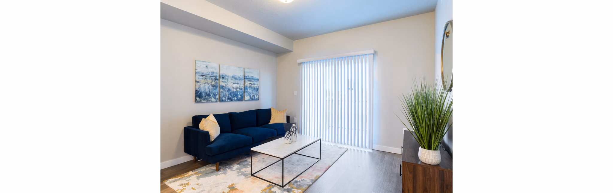 Cozy living room with stylish decor in Millpond Apartments, showcasing modern furniture and natural light