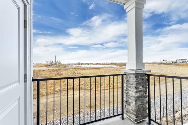 Charming patio with outdoor seating at Millpond Apartments