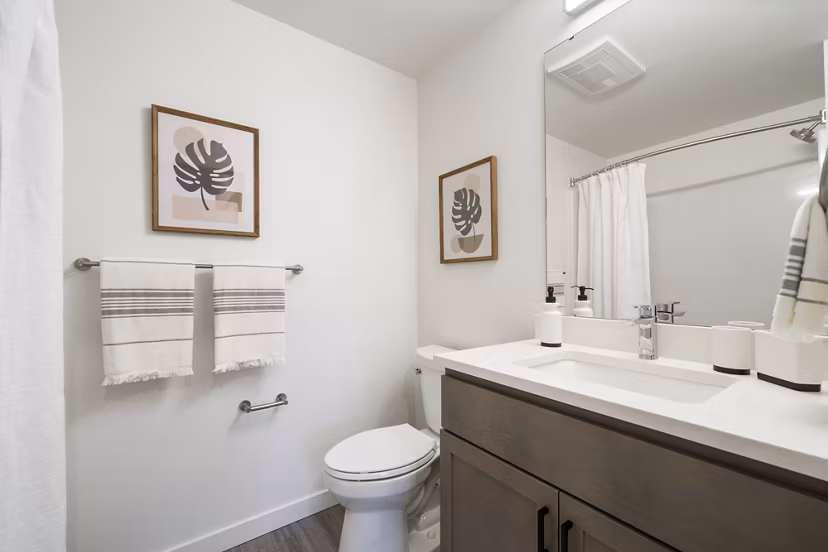 Spacious bathroom with modern fixtures at The Oliveen Apartments