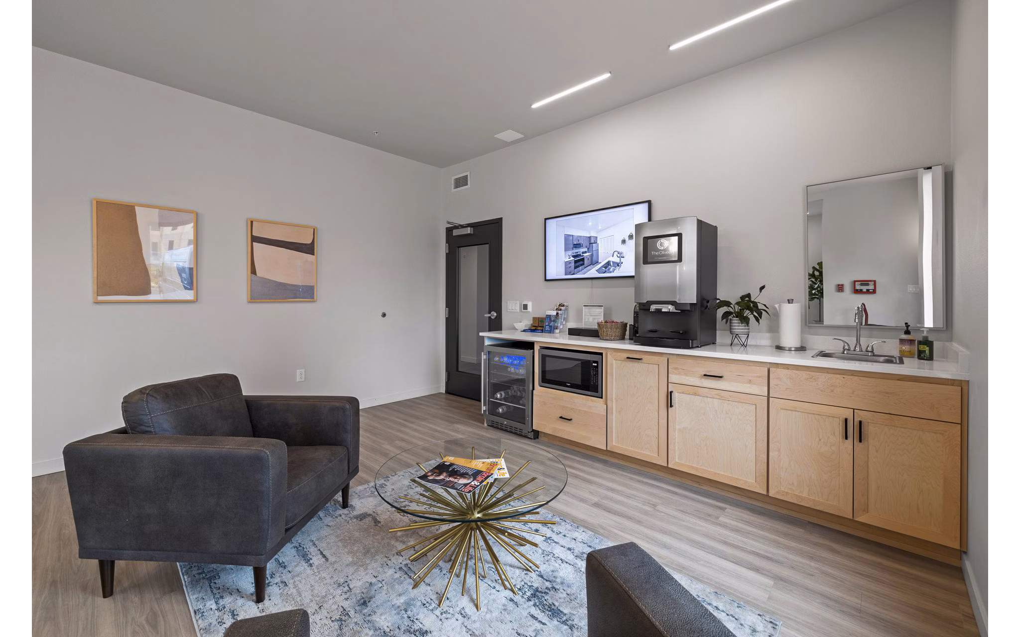 Clubhouse with modern design and cozy seating at The Oliveen Apartments, Greystar property offering stylish living in a vibrant community