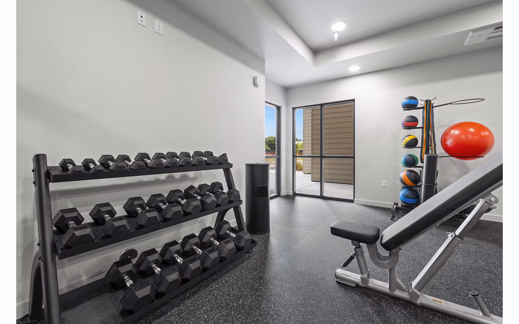 State-of-the-art fitness center with modern equipment at The Oliveen Apartments, luxury living by Greystar